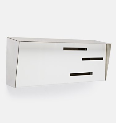 Wall-mounted midcentury modern mailbox with decorative slots in white