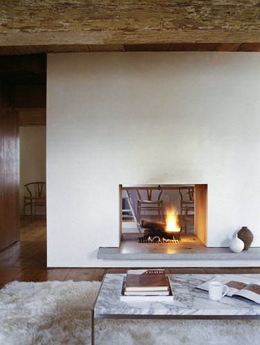 Cozy double-sided fireplace in a countryside cottage