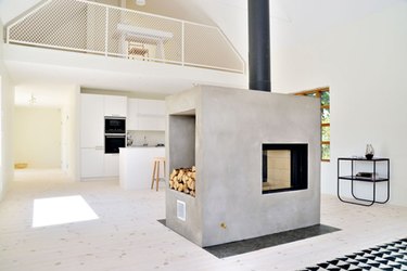 concrete chimney with double-sided wood-burning stove