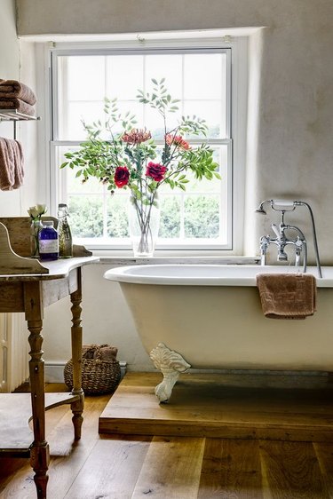 antique bathtub in this modern farmhouse bathroom idea