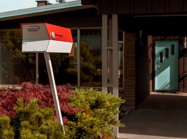 red and white ModBox midcentury modern mailbox in front of house