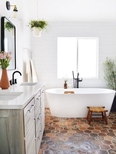 white bathroom with shiplap walls and brick floors