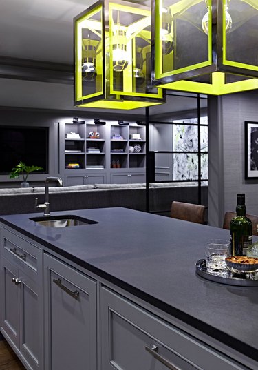 modern gray kitchen with lime green pendant lights