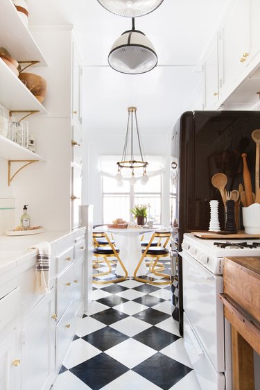 traditional galley kitchen with black and white checkered floor
