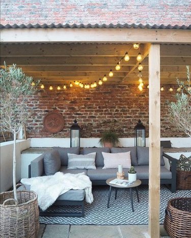 outdoor pergola with globe string lights