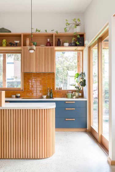 wood reeding on kitchen island and range hood