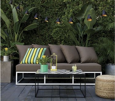 contemporary garden patio with industrial string lights