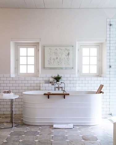 white farmhouse bathroom idea with a livestock feed trough as bathtub