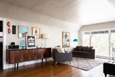 wood floor, living room, credenza and chairs