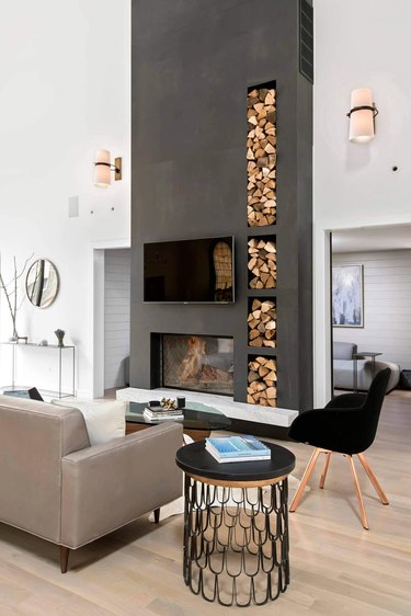 modern living room with two-sided gray fireplace