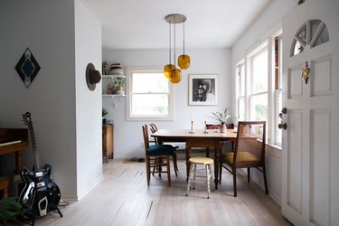 blonde hardwood floor, open view of small kitchen