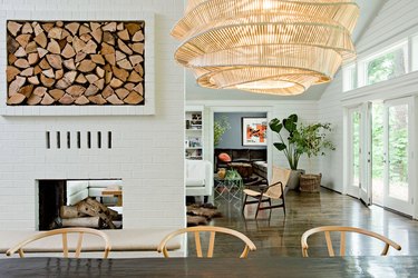 modern farmhouse dining room with two-sided fireplace