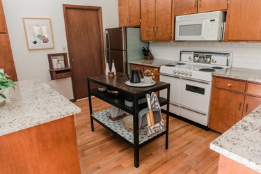 vintage kitchen, white stove, microwave, cherry cabinets, island