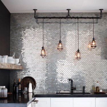 stainless steel mini subway tile backsplash in modern kitchen