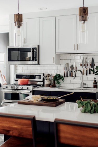 modern bohemian kitchen with subway tile backsplash and double sink