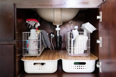 space under the sink with cleaning supplies