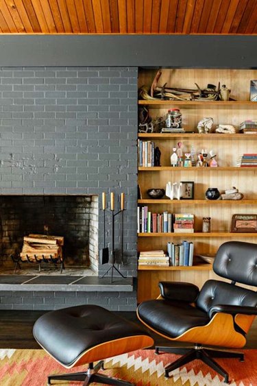 midcentury fireplace with gray brick surround