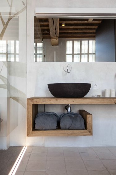 bohemian bathroom with geometric wood countertop