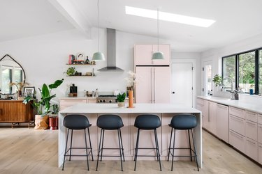 white kitchen with pink cabinets