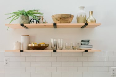 Piles of plates and bowls finish the look.