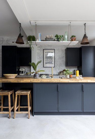 concrete kitchen floors in modern blue kitchen