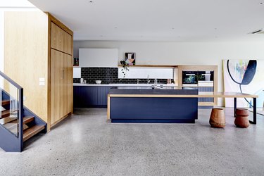 concrete kitchen floors in modern blue kitchen