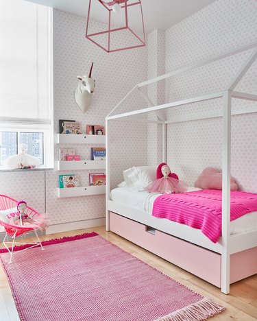 pink kids bedroom idea with Roman shade at window
