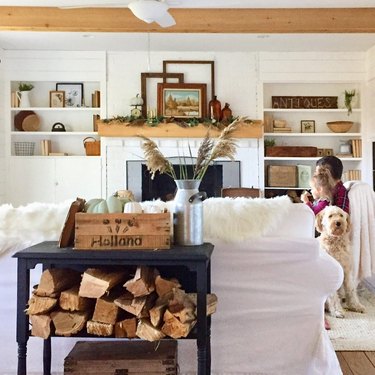 fall farmhouse mantel decorating idea with open shelving and exposed ceiling beams