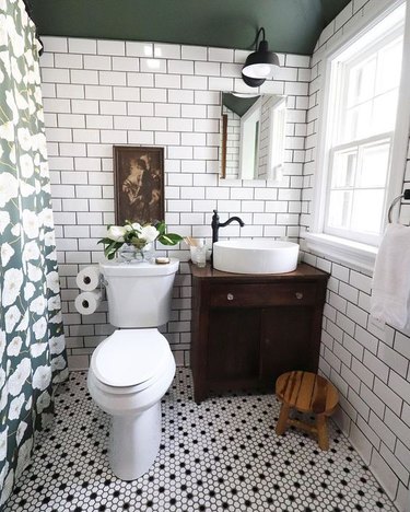 small farmhouse bathroom idea with subway tile walls and green paint