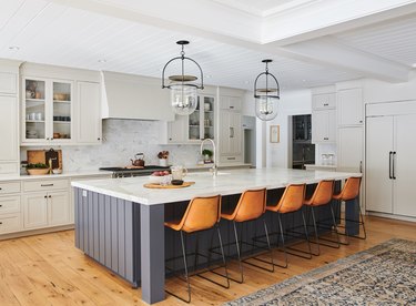 large black farmhouse kitchen island idea with leather stools