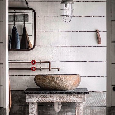 rustic bathroom with bleached wall