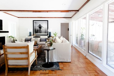 living room space with wood floors and white sofa