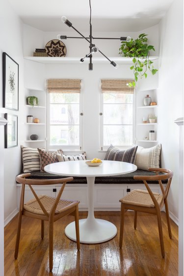 Small corner nook with dining room shelves by Katie Hodges Design
