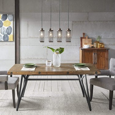 modern farmhouse table idea with metal base and upholstered dining chairs