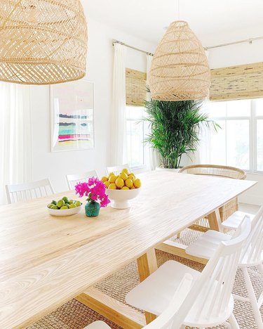 california style dining room table centerpiece with rattan pendants