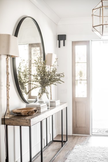 farmhouse entryway with huge mirror and wooden console