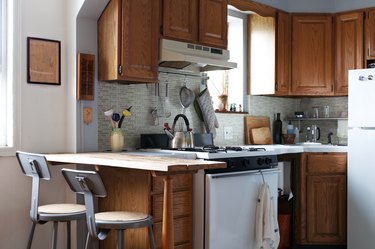 close up of small kitchen with bar seating