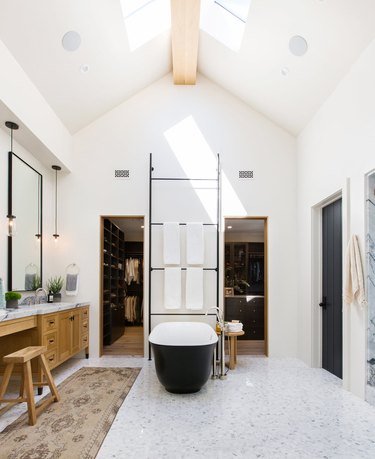 farmhouse bathroom with vaulted ceiling and marble mosaic floor tile