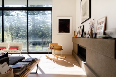 modern living room with floor-to-ceiling windows and light hardwood floors