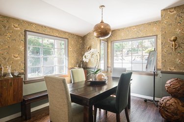 painted dining room wainscoting with chair rail and wallpaper above