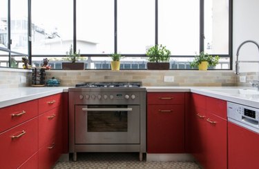 Red lower cabinets allow for a stylish kitchen that's also functional.