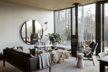 contemporary gray living room with wood stove fireplace