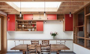 Add a few red cabinet doors to an otherwise neutral kitchen.