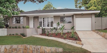 gray ranch home with single garage