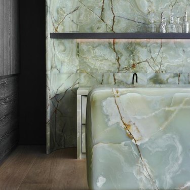 green onyx countertop and matching wall tile
