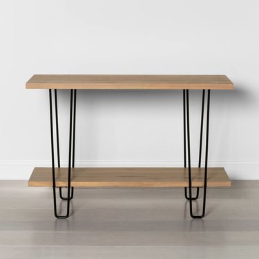 light wood media console with black hairpin legs