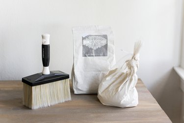 Limewash powder and masonry brush