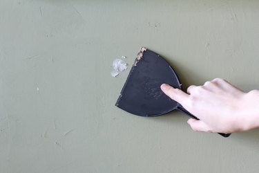 Spackling a hole in the wall