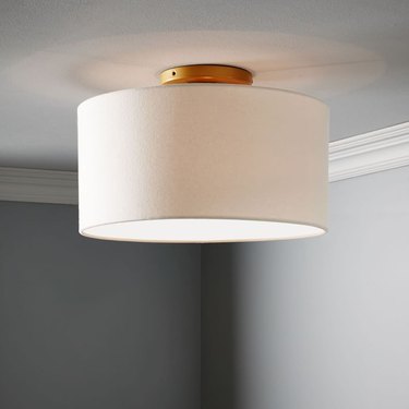 flush mount drum lighting for dining room with brass from West Elm