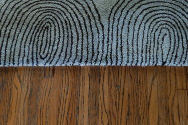 close up of carpet on wood floor